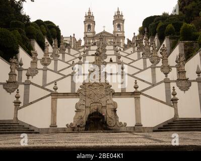 Stairway of the Five Senses: Vision, Hearing, Smell, Taste and Touch depicting the ascent to heaven at Bom Jesus do Monte is a Portuguese Stock Photo