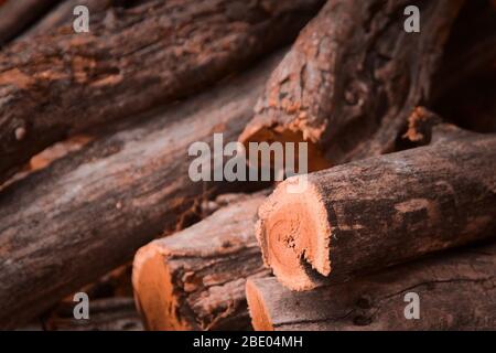Stack of logs for firewood. Rustic, countryside lifestyle background. Stock Photo