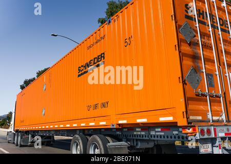 Dec 9, 2019 Los Angeles / CA / USA - Schneider truck driving on the freeway; Schneider National, Inc. is a provider of truckload, intermodal and logis Stock Photo