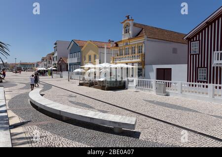 Picturesque promenade and colourful striped buildings at Costa Nova do Prado Ilhavo, a beach village resort on Atlantic coast near Aveiro Portugal Stock Photo