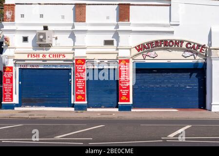 Closed businesses on sunny day on Southend on Sea seafront on Good Friday of Easter Bank Holiday during COVID-19 Coronavirus pandemic lockdown period Stock Photo