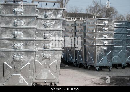 Warehouse of a new silver garbage containers. Stock Photo