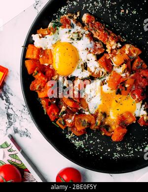 vegetables with herbs and fried eggs Stock Photo
