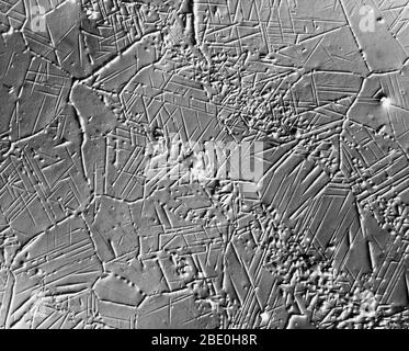 Scanning Electron Micrograph (SEM) showing sigma-phase crystallization in steel. Magnification: 500X at 8x10'. Nomarski interference contrast method. Stock Photo