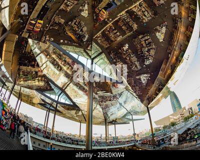 Reflection in mirrored roof of the Encants Vells Flea Market, with the Agbar Tower in the background, Barcelona Spain. Stock Photo