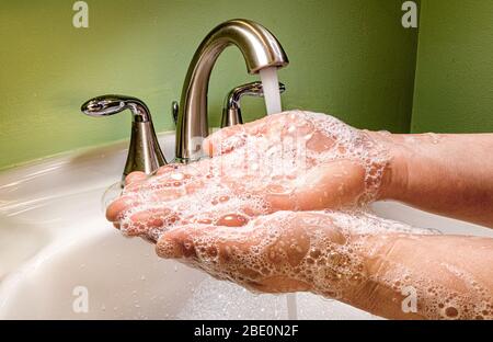 Woman Washing Her Hands During Quarantine Stock Photo