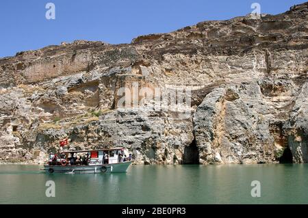 FIRAT RIVER, TURKEY - JANUARY 06: River boat in front of abandoned castle (Rum Kale) in Firat River (Euphrates River) on January 06, 2000 in Gaziantep, Turkey. Stock Photo