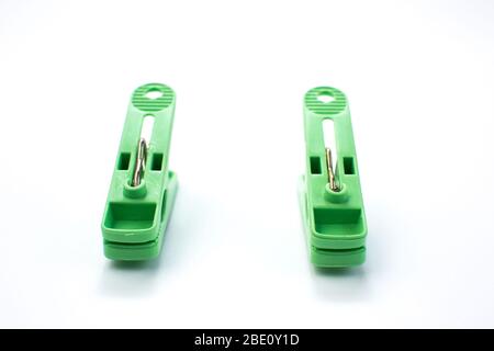 Green clothespins set. Isolated on white. Stock Photo