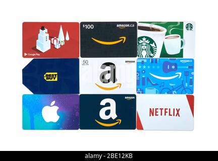 Montreal, Canada - April 9, 2020: Different gift cards of many brands such as Amazon, Netflix, Xbox, Google Play, Best Buy, Spotify, Starbucks. A gift Stock Photo