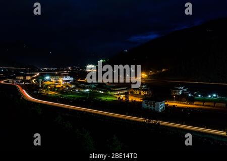 Light trails over the city during the rush hour dusk Stock Photo