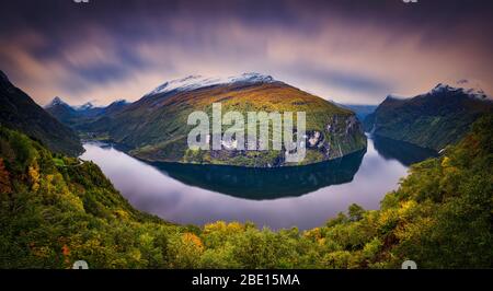 Panorama of fall colors in the mountains around Geiranger fjord in Norway Stock Photo