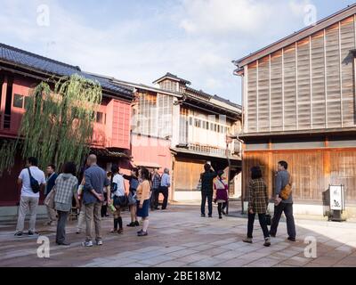 Kanazawa, Japan - September 28, 2015: Tourists strolling along the rows of traditional Japanese houses in Higashi Chaya old geisha district Stock Photo