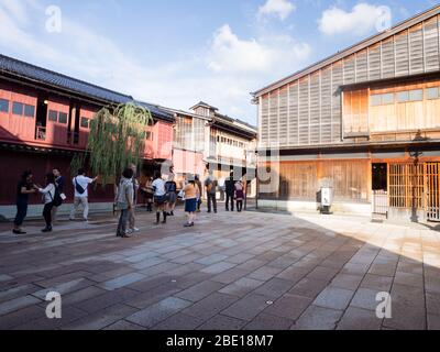 Kanazawa, Japan - September 28, 2015: Tourists strolling along the rows of traditional Japanese houses in Higashi Chaya old geisha district Stock Photo