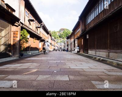 Kanazawa, Japan - September 28, 2015: Tourists strolling along the rows of traditional Japanese houses in Higashi Chaya old geisha district Stock Photo