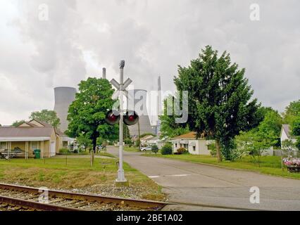 2007 - Coal powered company cooling tower behind a residential neighborhood Stock Photo