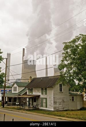 2007 - Coal powered company cooling towers behind a residential neighborhood Stock Photo