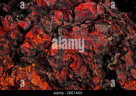 Close up background photo on the texture of a large stone of red jasper Stock Photo