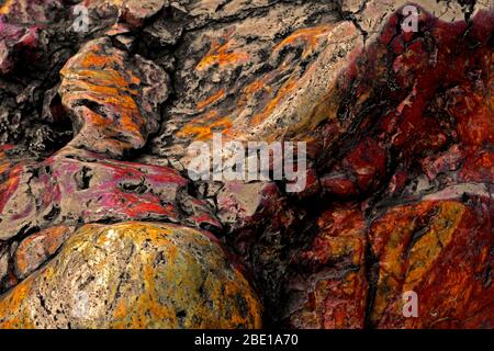 Close up background photo on the texture of a large stone of red jasper Stock Photo