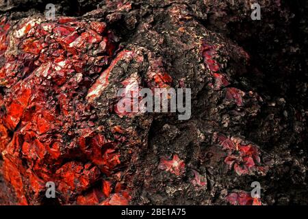 Close up background photo on the texture of a large stone of red jasper Stock Photo