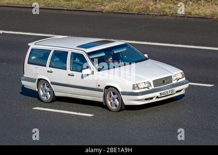 1994 white Volvo 850 S Auto; Vehicular traffic moving vehicles, driving vehicle on UK roads, motors, motoring on the M6 motorway highway Stock Photo