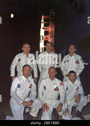 View of the Apollo 8 primary and backup crew portrait with the spacecraft at night in the background. Back row: (l.-r.) Frank Borman, commander, James A. Lovell, command module pilot and William A. Anders, lunar module pilot. Front row: (l.-r.) Neil A. Armstrong, commander, Edwin E. Aldrin, command module pilot and Fred W. Haise Jr., lunar module pilot. Stock Photo