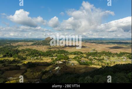 amazing landscape in the countryside with a stream flowing by and a vista of the clouds and the mountains Stock Photo