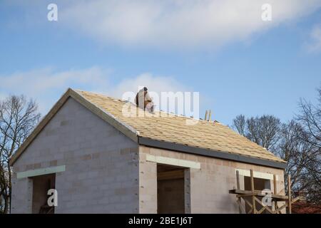 Worker on the rooftop Stock Photo