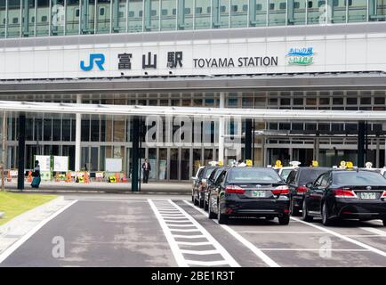 September 26, 2015: Taxis waiting at the entrance to JR Toyama station - after the opening of new Hokuriku shinkansen line Stock Photo