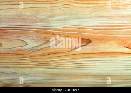 A beautiful pattern of wood fibers in the form of a new smooth wooden veneer with horizontal guides. Stock Photo