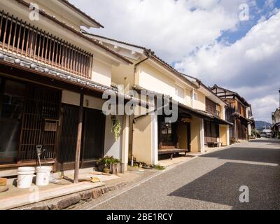 Uchiko, Japan - March 03, 2013: Sun shining over Edo period traditional merchant houses in historic Uchiko town Stock Photo