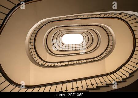 Looking up at the spiral staircase Stock Photo