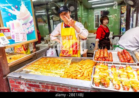 Street food seller in china. Stock Photo