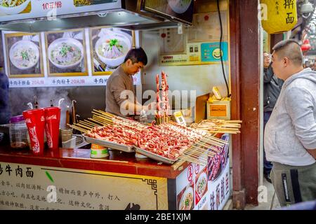 Street food seller in china. Stock Photo