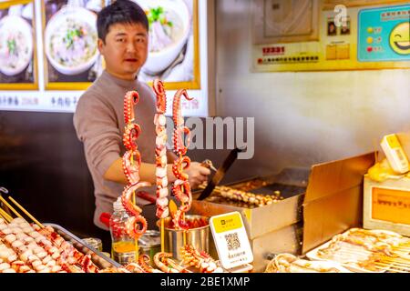 Street food seller in china. Stock Photo