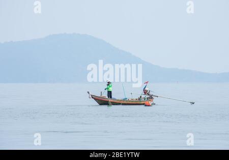Fishermen netting fish on a boat at sea at Koh Talu , Prachuap Khiri Khan in Thailand. March 16, 2020 Stock Photo