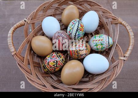 Decorated Easter eggs in a wicker basket Stock Photo