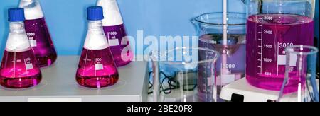 Colored liquid in bottles, chemical laboratory. The concept of scientific research and development. Stock Photo