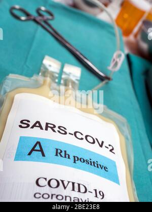 Plasma bag with antibodies from people cured of SARS-COV-2 Covid-19 prepared in a hospital, conceptual image Stock Photo