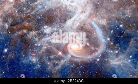 Spiral galaxies and nebula in deep space. Elements of this image furnished by NASA. Stock Photo