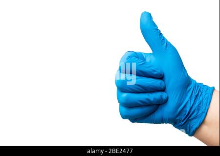 Hand of a nurse with glove making ok sign. Healing concept. Stock Photo