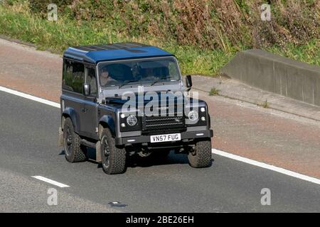 2007 Image 4x4 modified black grey off-roader Land Rover Defender 90 Hard Top; Vehicular traffic moving vehicles, driving vehicle on UK roads, motors, motoring on the M6 motorway highway Stock Photo