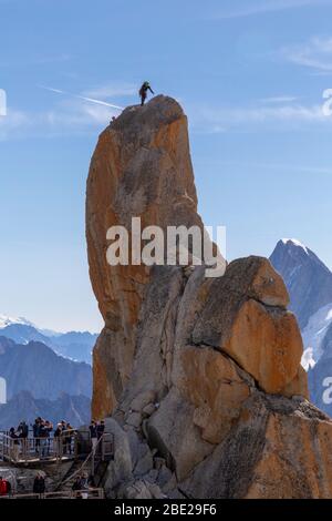 South Piton, rock located in the Aiguille du Midi in the Mont Blanc massif, which dare to climb large numbers of mountaineers Stock Photo