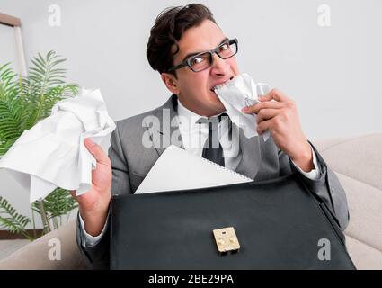 The angry businessman with crumbled paper Stock Photo