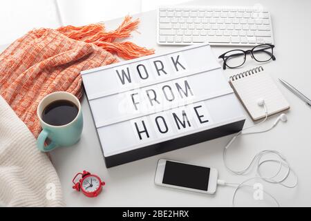 Work from home word on lightbox with working stuff, quarantine for coronavirus Stock Photo