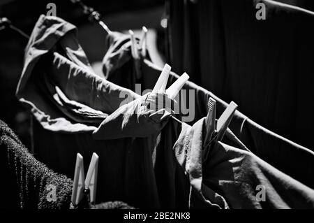 Towels and clothes hanging on a drying rack with clothespins (Pesaro, Italy, Europe) Stock Photo