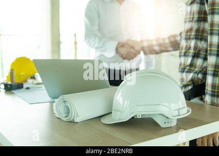 Close up engineer shaking hand with Stock Photo