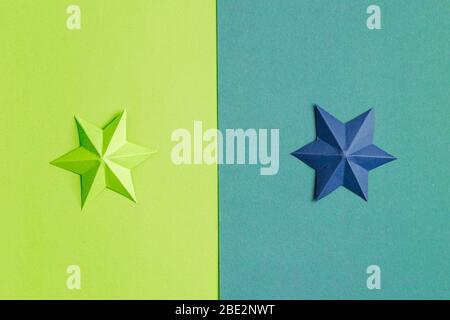 Colored paper stars over different background Stock Photo