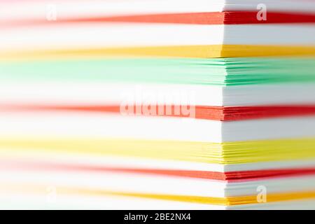 Stack of Colored layers of papers, macro shot. Stock Photo