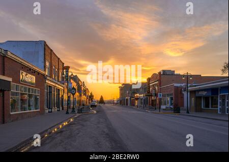 Fort MacLeod, Alberta, Canada - April 09, 2020: Sun setting on the prairie town’s historic Main Street Stock Photo