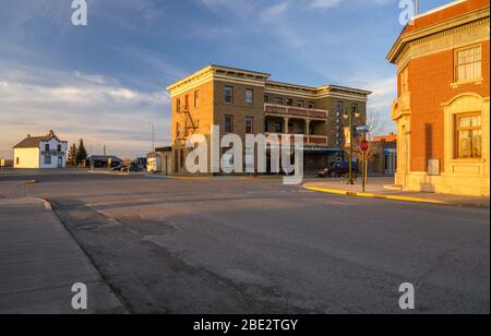 Fort MacLeod, Alberta, Canada - April 09, 2020: Sun setting on the prairie town’s historic Main Street Stock Photo